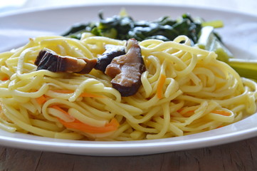 stir fried vegetarian noodle with mushroom and Chinese cabbage on plate