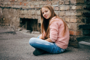 beautiful young girl posing on the street