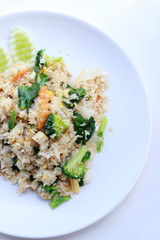 fried rice with vegetable on the white plate with withe background. Vegetarian Food, healthy food, Thai cuisine