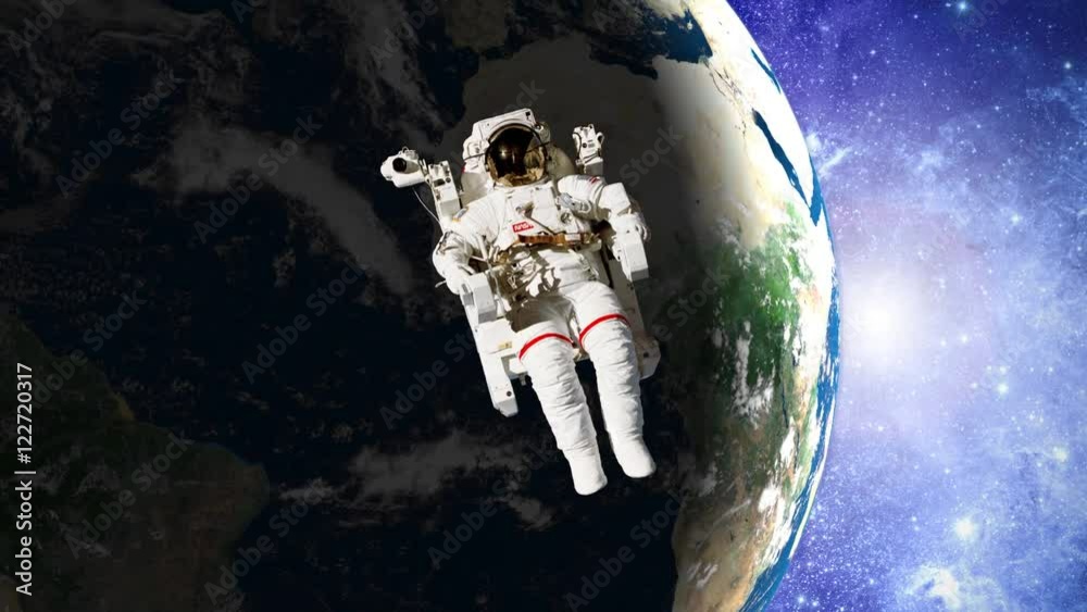 Wall mural astronaut in open space in front of earth