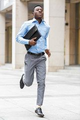 businessman with briefcase running