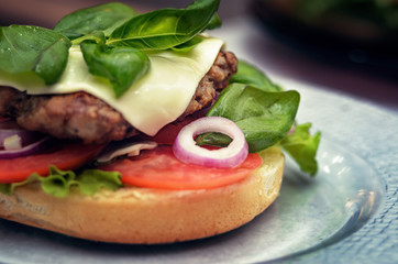 Have added  cheese and basil in hamburger. Cooking burger concept