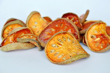 dried bael fruit on white background