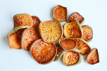 dried bael fruit on white background