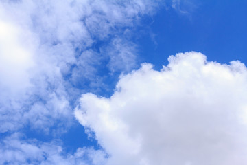 Blue sky background with white clouds. The vast blue sky and clouds sky on sunny day. White fluffy clouds in the blue sky.