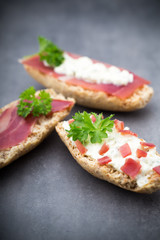 Crispbread with soft cheese with herbs and bacon.