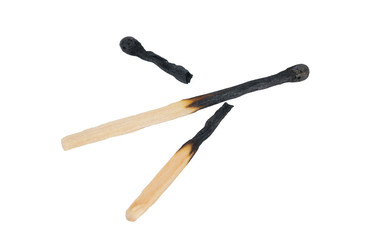two broken burnt matches on a white background