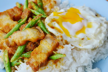 spicy stir fried crispy pork and yard long bean in curry and creamy egg yolk