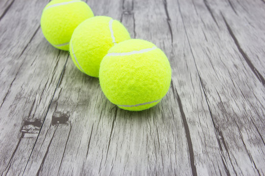 Tennis ball on wood floor