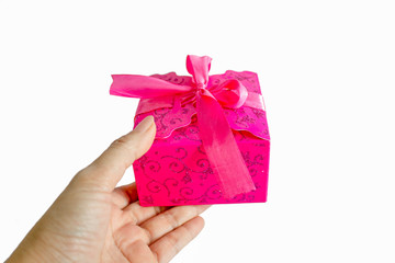 hand giving pink gift box