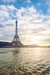 Fototapeta na wymiar Eiffel tower and river Seine in Paris at sunset, France.