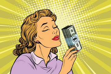 businesswoman smelling the scent of money © studiostoks