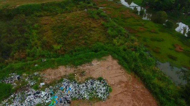 Camera is flying over  dump of domestic garbage