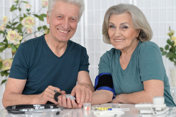 portrait of  senior couple with pills