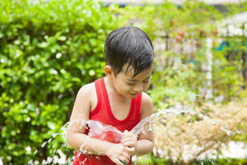 Happy boys with hose © suthisak