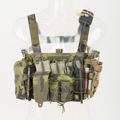 Fototapeten Bulletproof vest with blanks and radio and military equipment, bulletproof vests, caps, fully equipped tactical vest, Camouflage Brown © murmakova