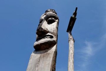 sculptured wood with blue sky