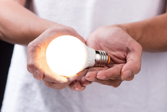 Energy saving light bulb, Creative light bulb idea in the hand