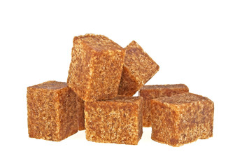 Brown sugar cubes isolated on a white background