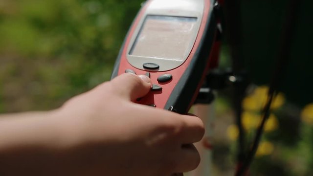 Worker prepare geodetic device for surveying