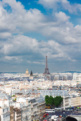 skyline of Paris city roofs with seine river and Eiffel Tower from above, France