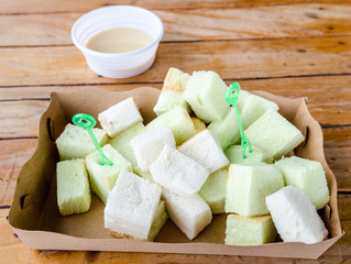 Bread in paper package with .sweetened condensed milk