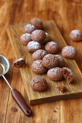 Chocolate Cookies on wooden board and wooden table.