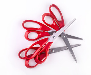 new red paper scissors on white