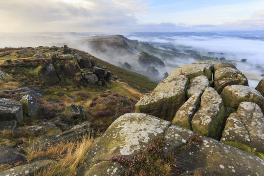 Early morning fog, Curbar Edge with view to Baslow Edge, Peak District National Park, late summer heather, Derbyshire
