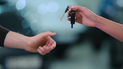 Man give a cars keys the girl