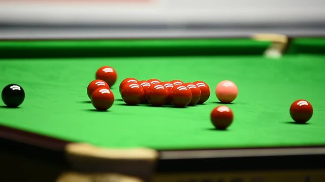 Detail video with snooker player hitting the ball during competition