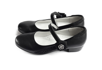 Pair of black shoes for girl on white background