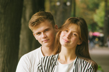 Fototapeta premium Romantic couple together in a park in autumn