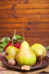 Autumn ripe juicy pears on a wooden table