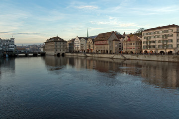 Fototapeta na wymiar Sunset panorama of city of Zurich and reflection in Limmat River, Switzerland