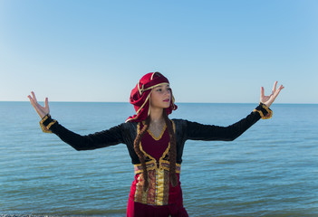 woman dancing georgian national clothes sea outdoors