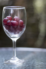 red grape in wine glass
