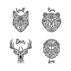 Black hand drawn vector lion, wolf, deer and bear heads with ethnic floral pattern