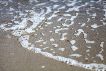 Fototapeta na wymiar Wave rolling on the beach