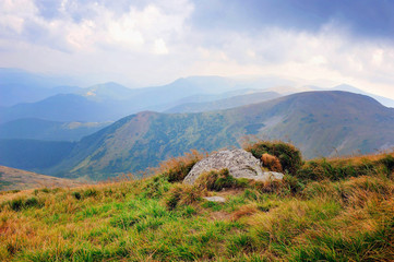 Fantastic mountain landscape. Autumn, dramatic sky with clouds. Carpathian, Ukraine, Europe.
