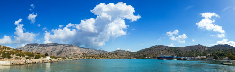 Fototapeta premium panorama of Bay of panormitis of Symi , the ships. and boats at anchor