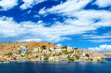 Obraz premium Greece. Dodecanesse. Island Symi Simi . Colorful houses on rocks