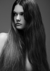 Portrait of beautiful young girl with long hair