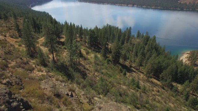 Beautiful Aerial Over Dry Eastern Washington Forest to Reveal Lake Roosevelt