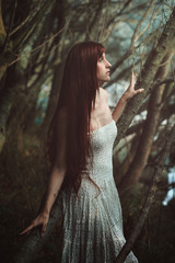 Fototapeta premium Fine art portrait of red hair woman