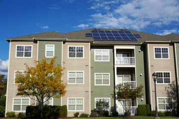 apartment with solar panel installed on roof