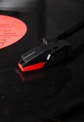 Close-up turntable needle and vinyl disk