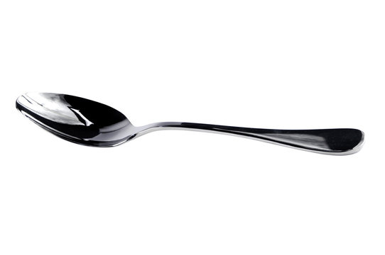 Large Stainless steel Kitchen spoon isolated against white backg