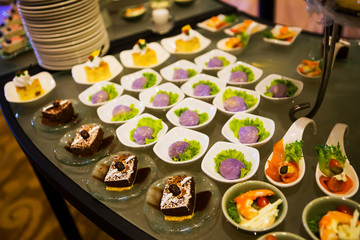 Close-up view of dessert buffet with delicious sweet bakery and