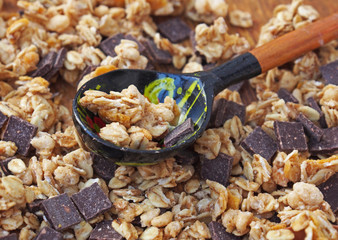 Healthy breakfast - chocolate muesli  in wooden table